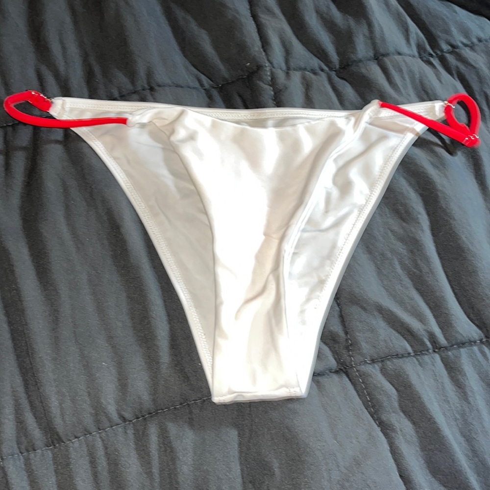 White bikini bottoms with red side adjustable strings